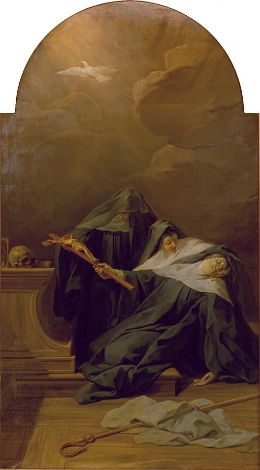 A nun holding a crucifix near another nun collapsed