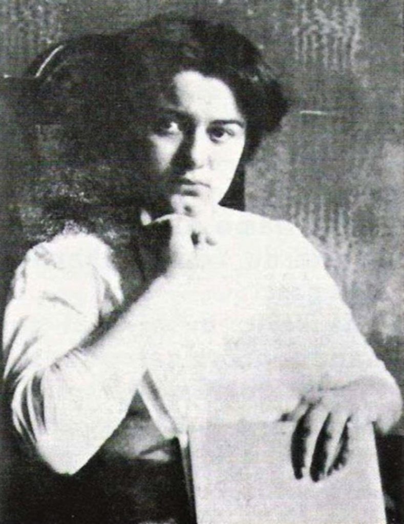 Old photograph of Edith Stein sitting in a chair.