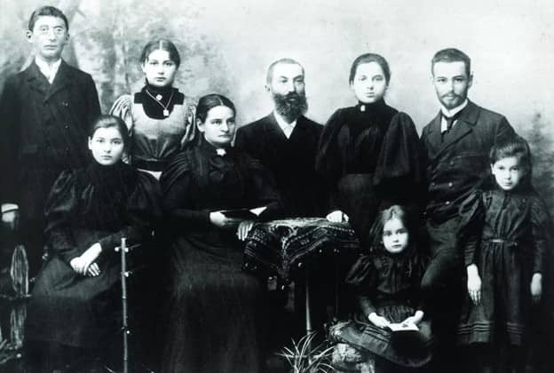 a black and white photo of a family from late 1800s